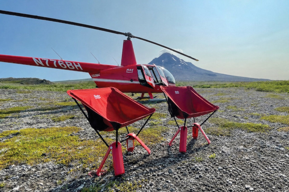 Red helicopter in remote Alaska volcano country