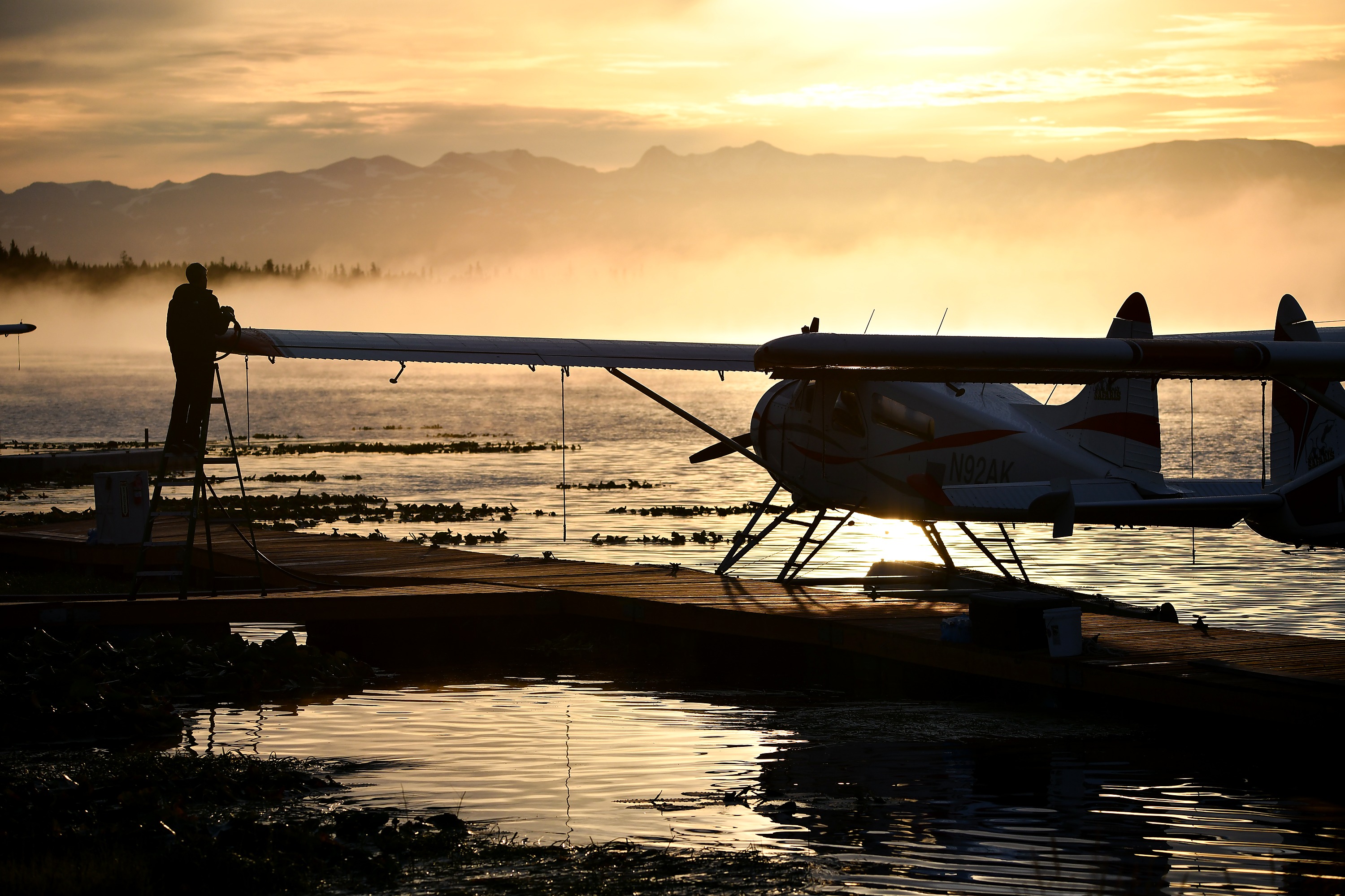 Alaska Ultimate Safaris floatplane in golden light