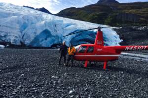 Helicopter on a remote Alaska glacier landing during a Homer flightseeing tour